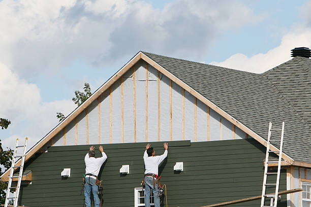 Professional Storm Damage Siding Repair technician working in Riverside, IL